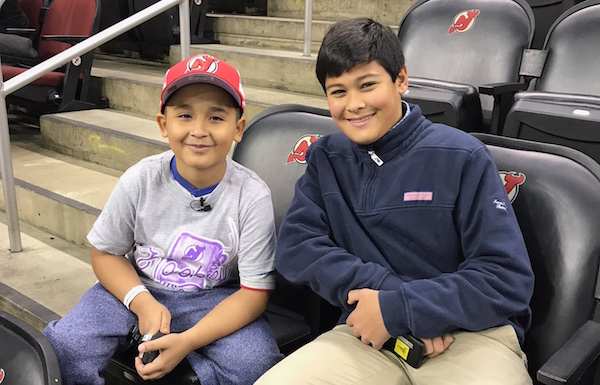 Devils coach for the day Abdiel Collazo with Kid Reporter Christopher John